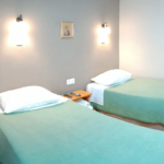Twin room beds at Prosforio accommodation in Ouranoupoli Chalkidiki Greece.