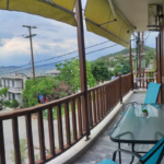 Balcony sea view with outdoor furniture at Prosforio Rooms in Ouranoupoli Halkidiki.