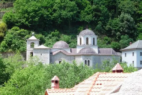 The central stone church and bell tower of Lakkoskiti, a Romanian Orthodox community on Mount Athos.