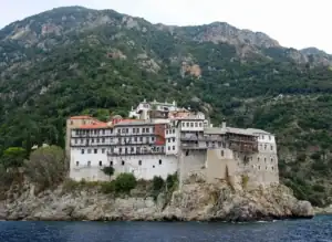 The Holy Monastery of Moni Grigoriou built on a rocky cliff by the sea at Mount Athos.