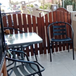 Private yard with outdoor seating for the ground floor triple studio at Prosforio Rooms in Ouranoupoli Chalkidiki.