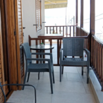 Furnished balcony of twin apartment at Prosforio Rooms in Ouranoupoli.